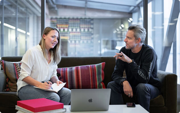 team members discussing on the couch