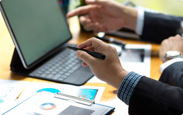 person pointing at computer