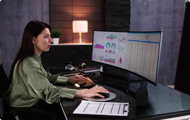 woman reviewing data on computer